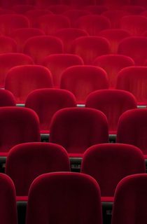 Empty red seats in a theatre