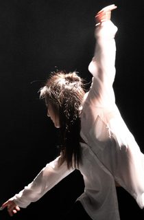 Person in casual wear dancing onstage