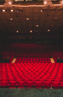 Empty red seats in a theatre