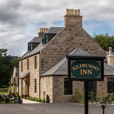 Kildrummy Inn Exterior with sign 05 289 A1175 Photograph by Angus Bremner Straightened Copy